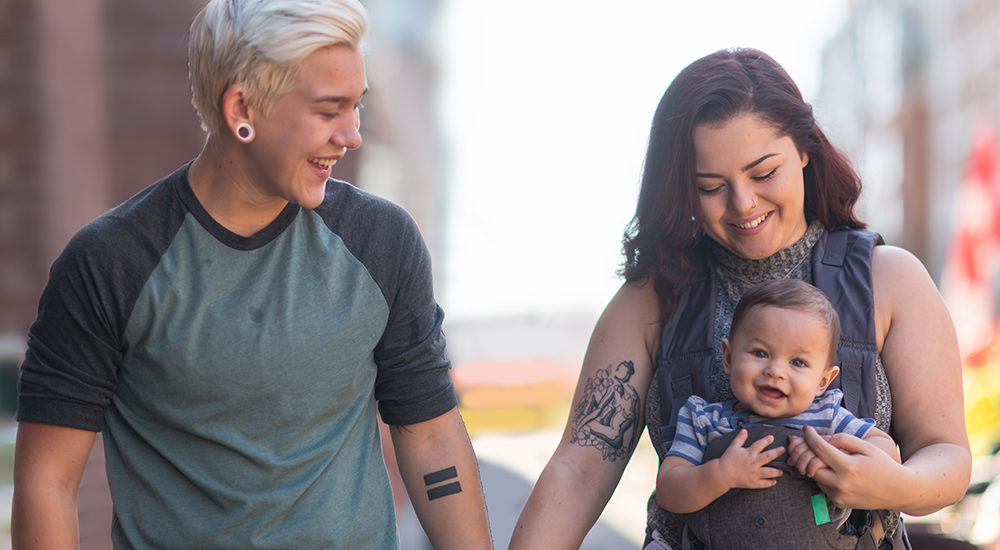 Couple walking with their baby