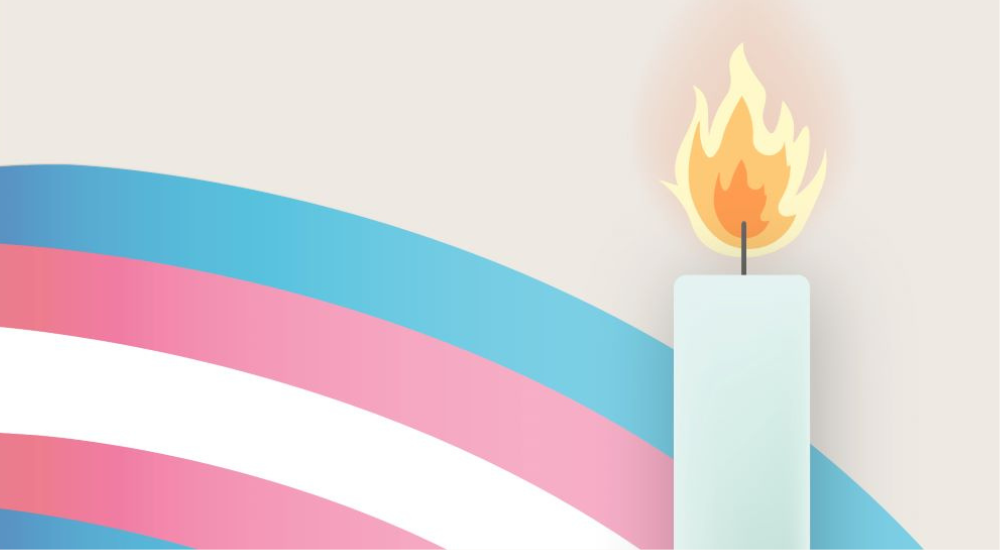 Candle in front of a rainbow of trans flag colours